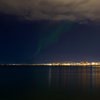 Northern Lights dancing over Reykjavik, capital of Iceland